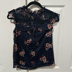 Navy blue floral blouse.